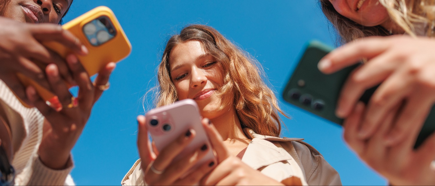 Group of students looking at phones