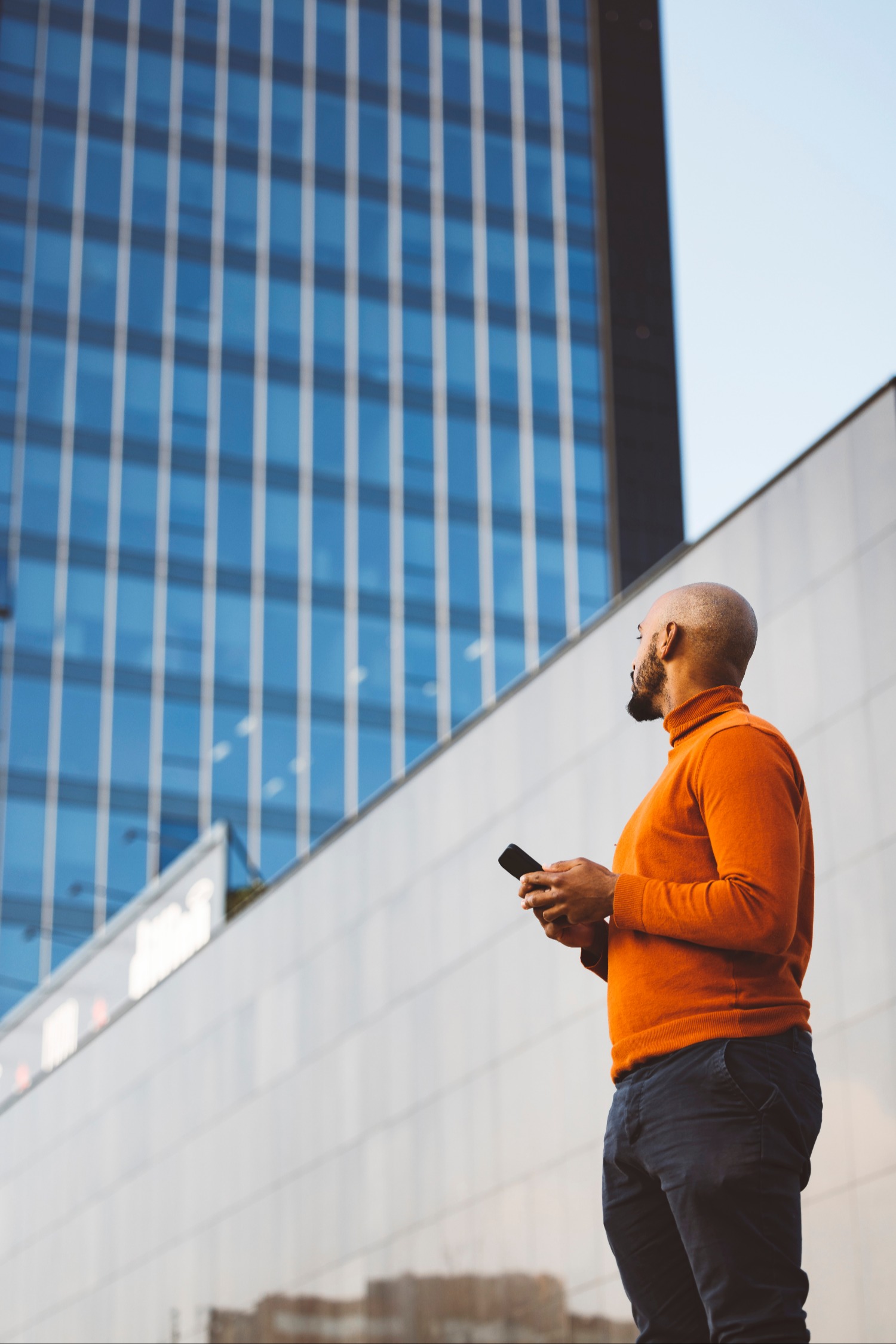 Man standing and smiling outside