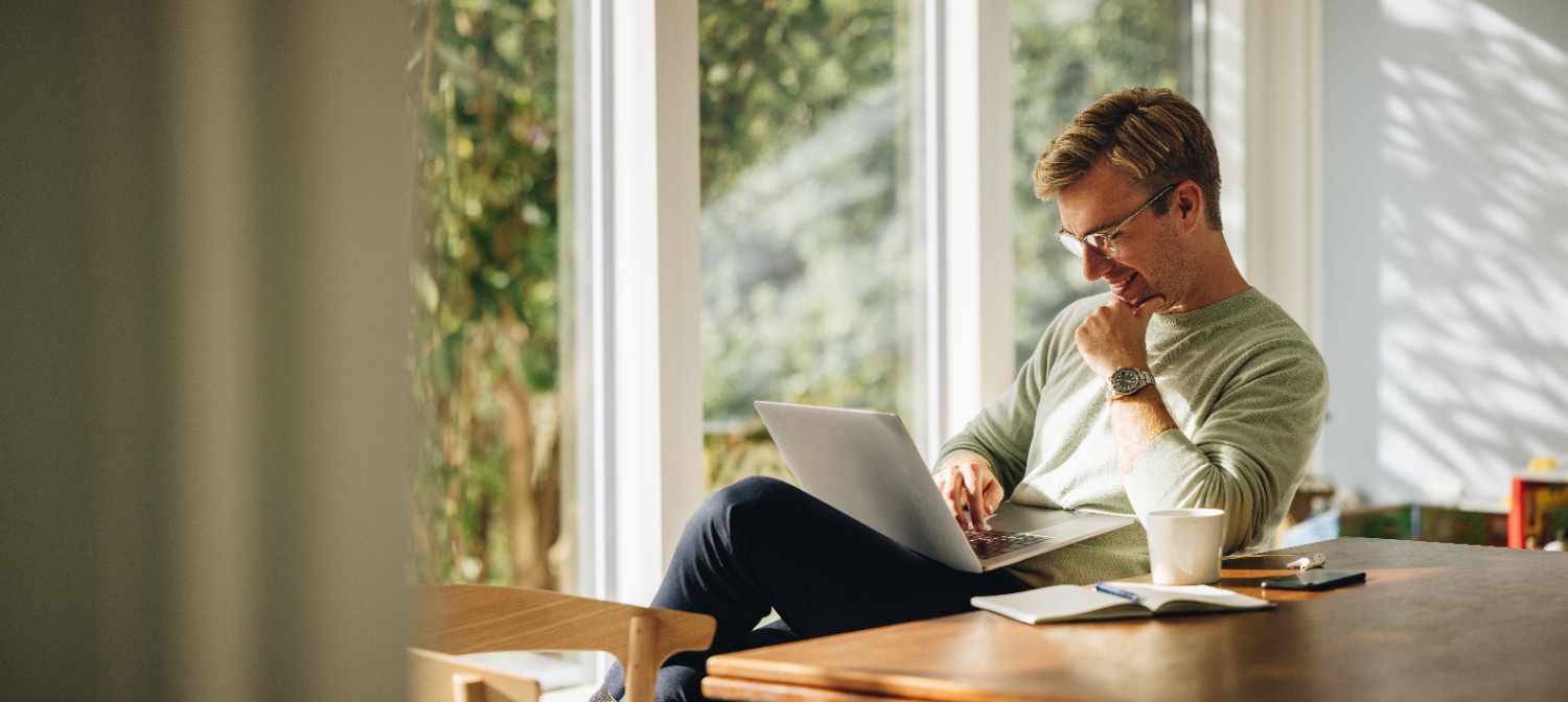 Man sitting using laptop