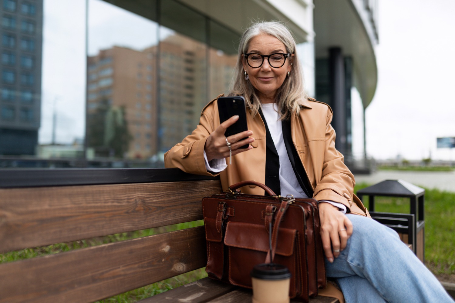 Smiling woman using phone